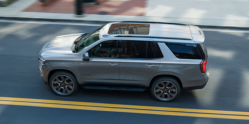 Silver Chevrolet Tahoe driving down a highway in Ashland, OR